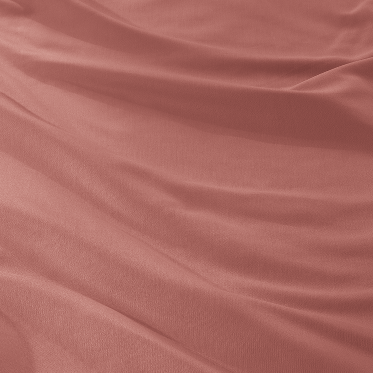 Closeup of dusty rose Organic Cotton Sateen Sheet Set fabric texture