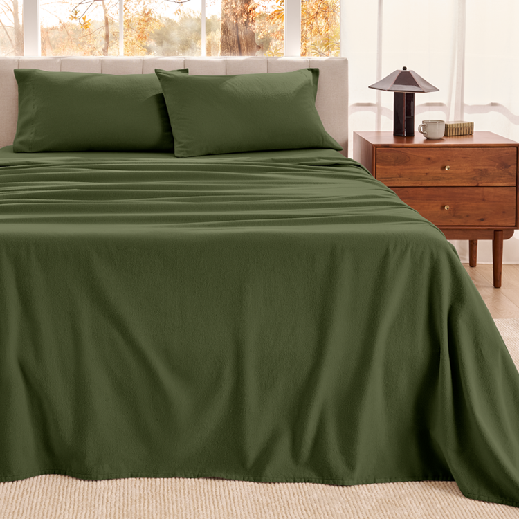 Close-up of dark olive green organic flannel fabric