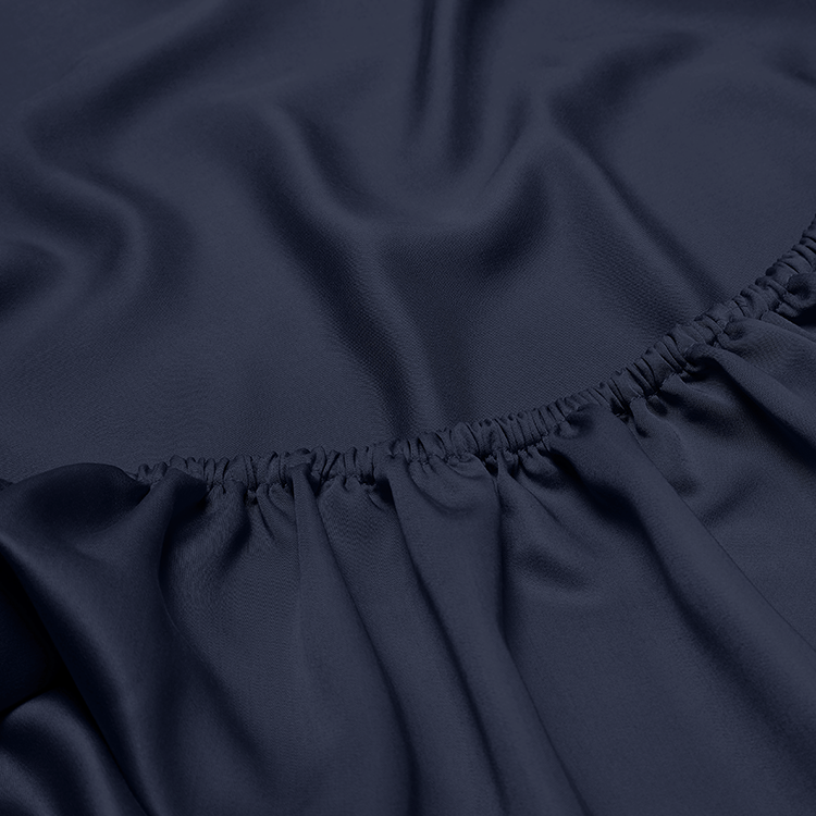 Close-up of navy bamboo fitted sheet fabric