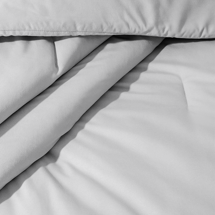 Closeup of light gray Ultra Soft Track Stitch Comforter Set fabric texture