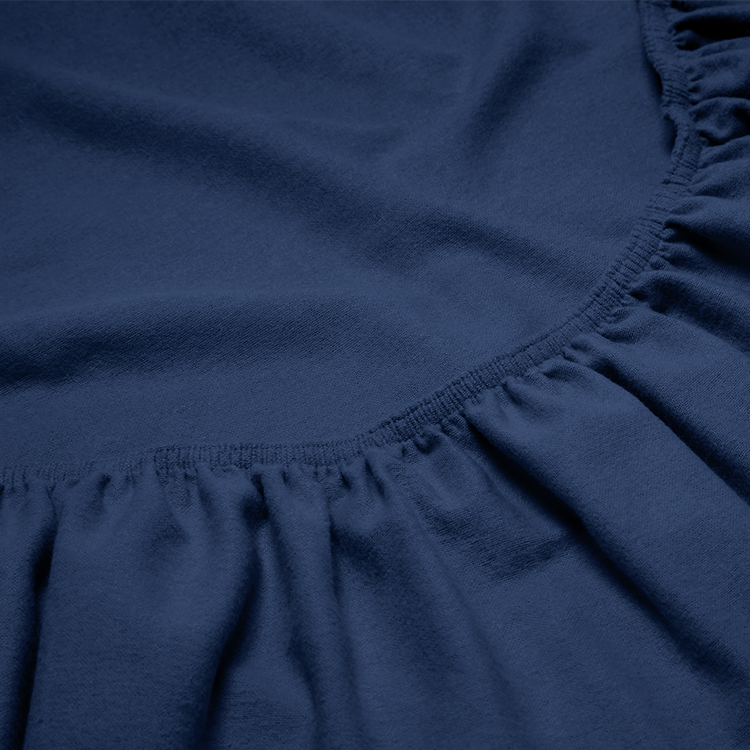 Close-up of navy flannel fitted sheet fabric