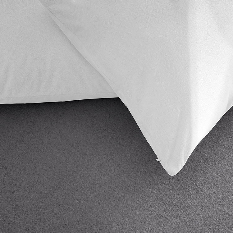 Closeup of white Cotton Terry Pillow Protector fabric corner