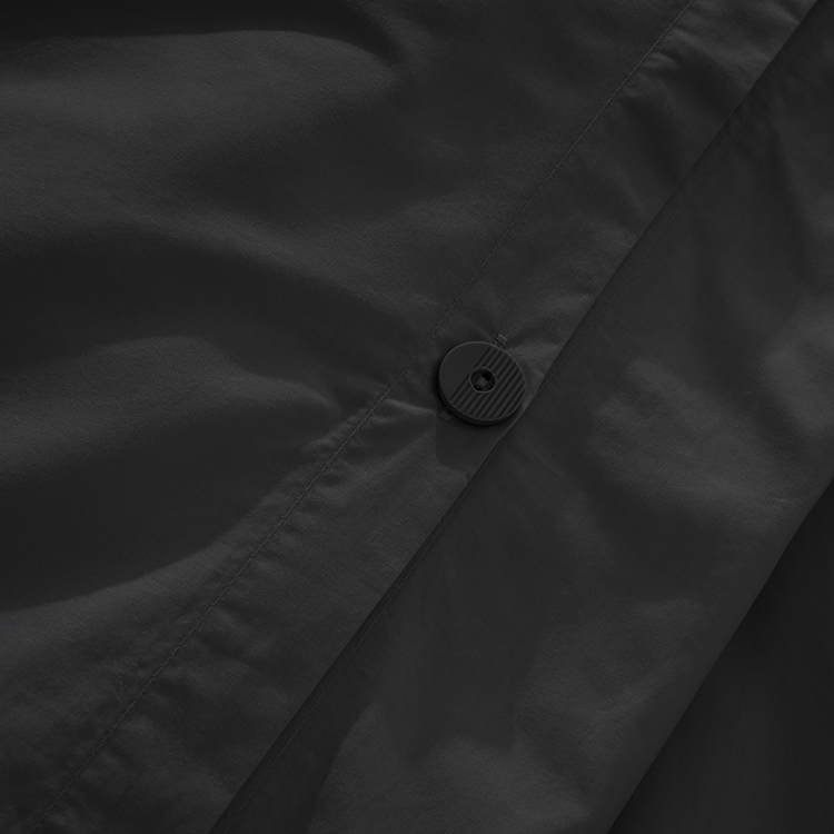 Closeup of dark charcoal Organic Cotton Percale Dorm Bundle fabric texture