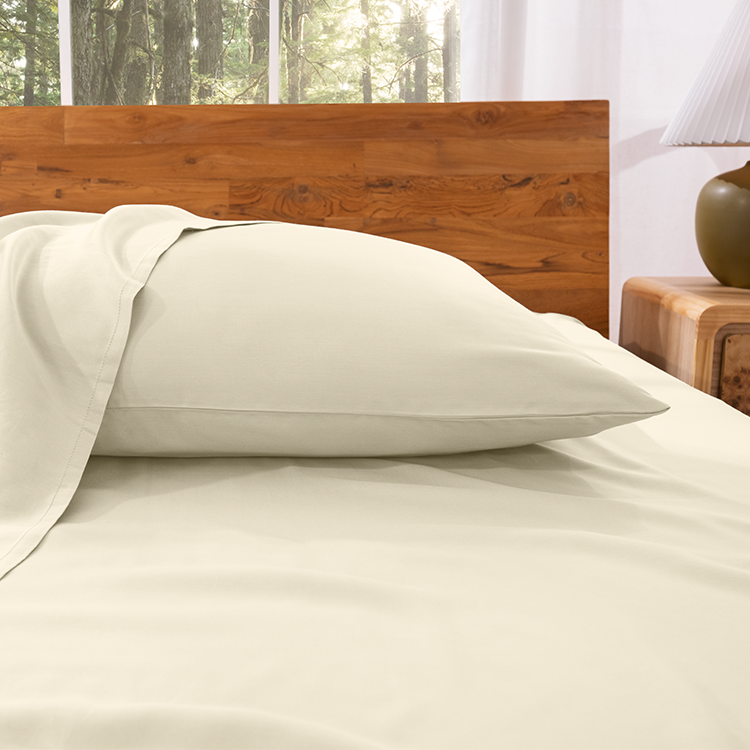 Closeup of cream TENCEL Lyocell Pillowcase Set fabric on a pillow