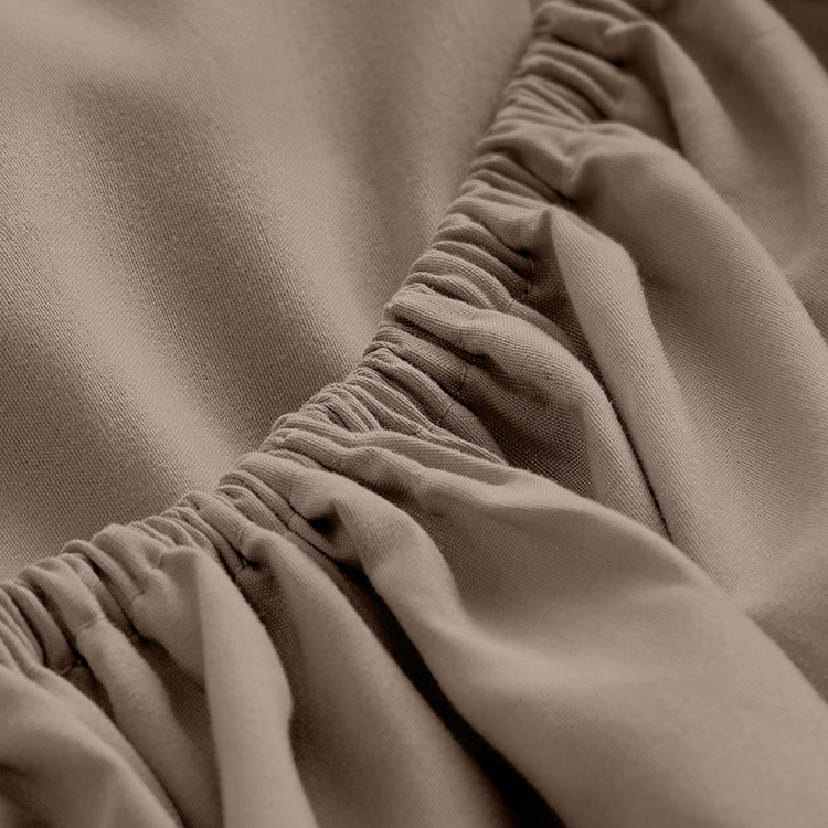 Closeup of taupe Ultra Soft Bed In A Bag fabric with ruched texture