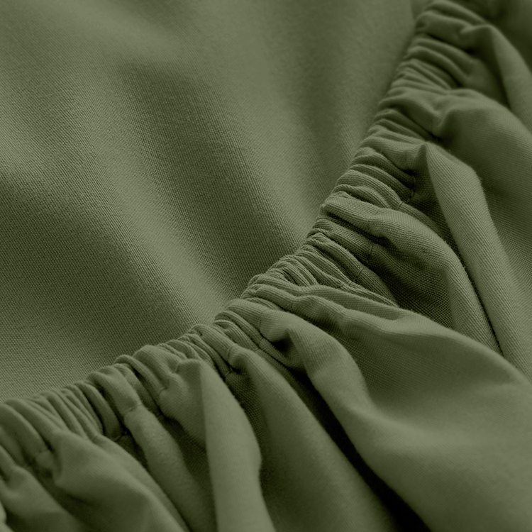 Closeup of dark olive green Ultra Soft Fitted Sheet fabric corner