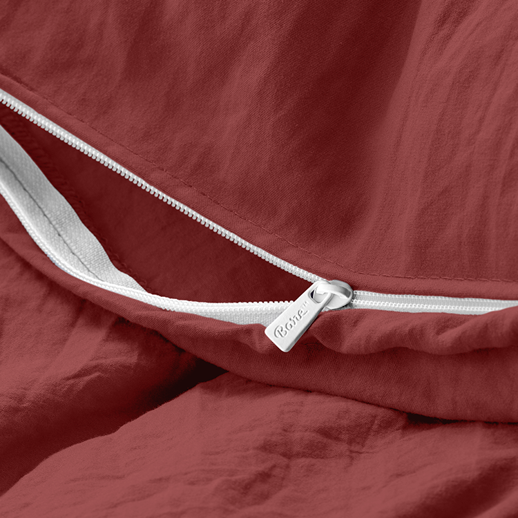 Closeup of dark red Ultra Soft Washed Bedding Bundle fabric with tie closure