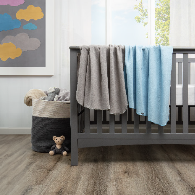 Stack of folded blue striped flannel blankets on a shelf