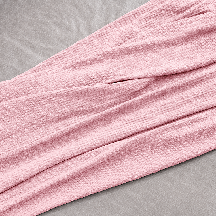 Close-up of pink waffle blanket fabric