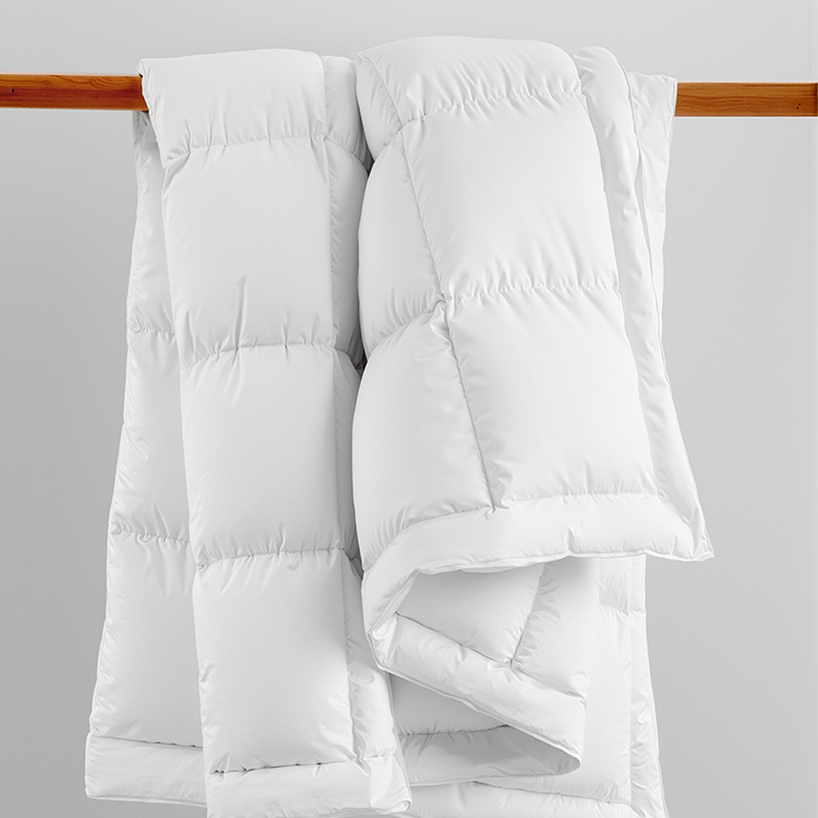 Close-up of white down comforter texture