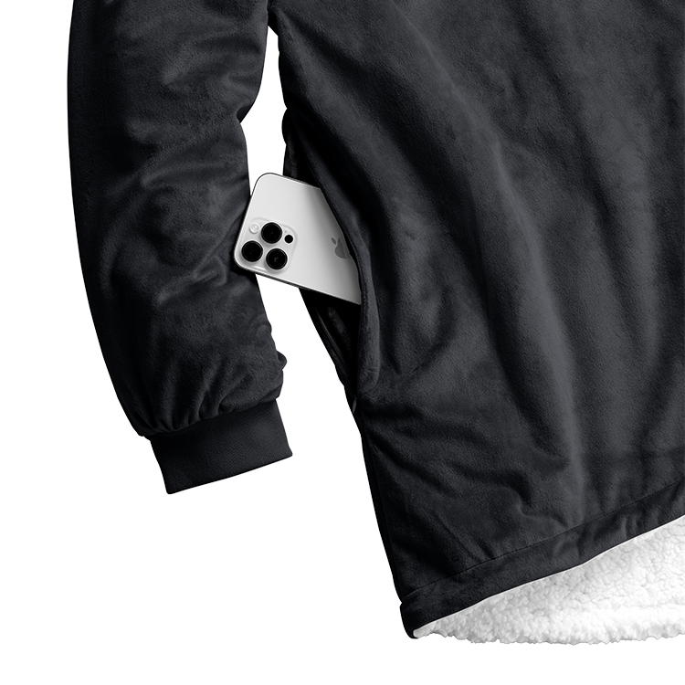 Closeup of black Bare Homey Wearable Blanket (Sherpa Adult) fabric with snap button
