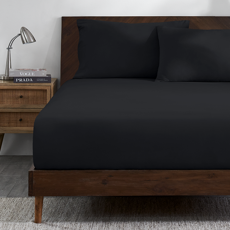 Bed with dark navy Organic Cotton Jersey Fitted Sheet
