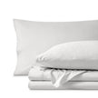 Percale bedding set including pillowcases and folded sheets arranged on a clean white background