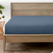A mattress with just a fitted sheet on it
