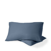 Two pillows with percale pillowcases on them