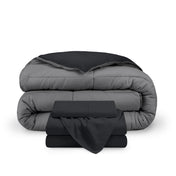 A reversible microfiber comforter and a coordinating sheet set folded and stacked