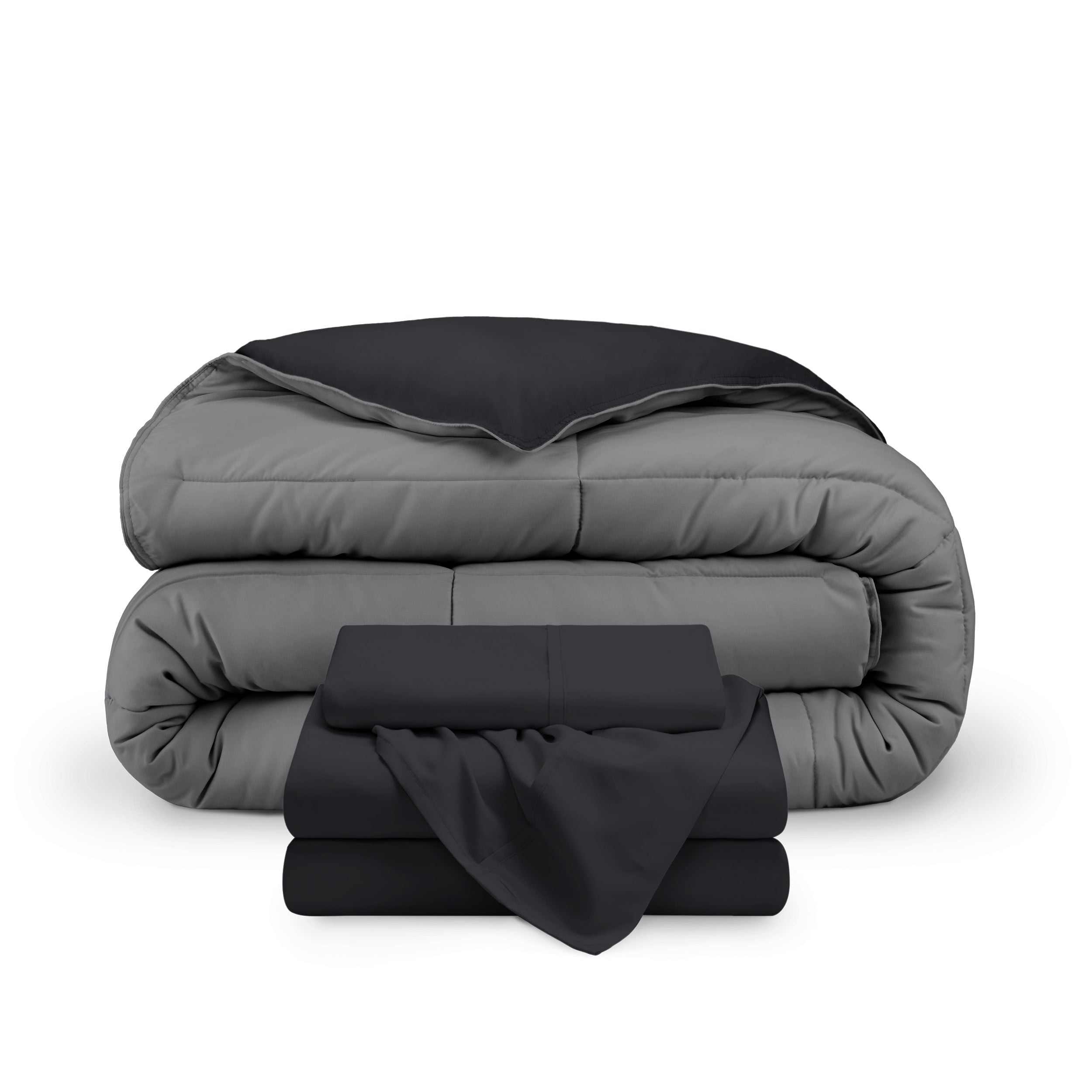 A reversible microfiber comforter and a coordinating sheet set folded and stacked