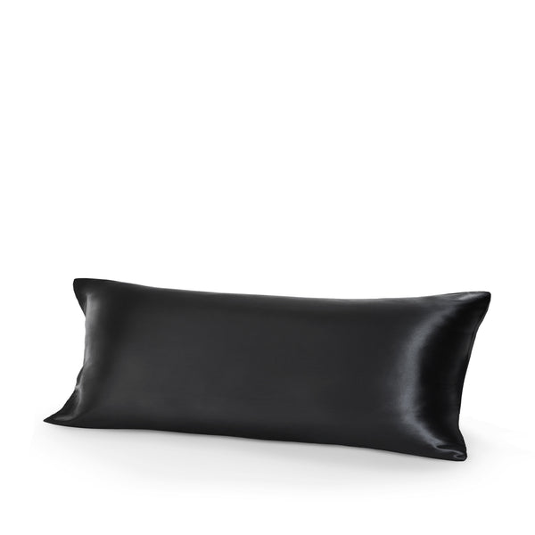 Black silk pillow on a white background