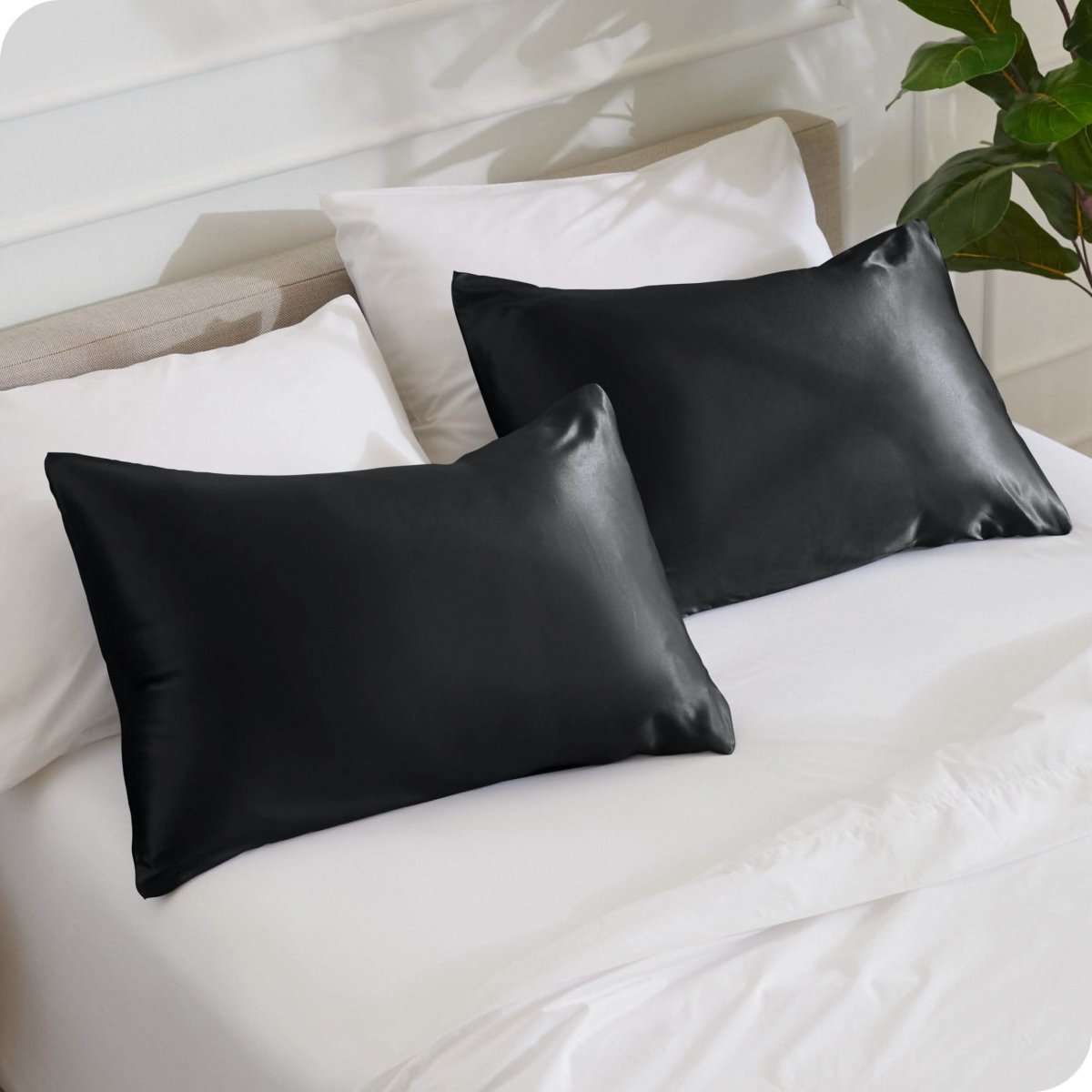 2 mulberry silk pillowcases on pillows set on a bed