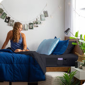 Bed made with a fitted sheet which has pockets on the side