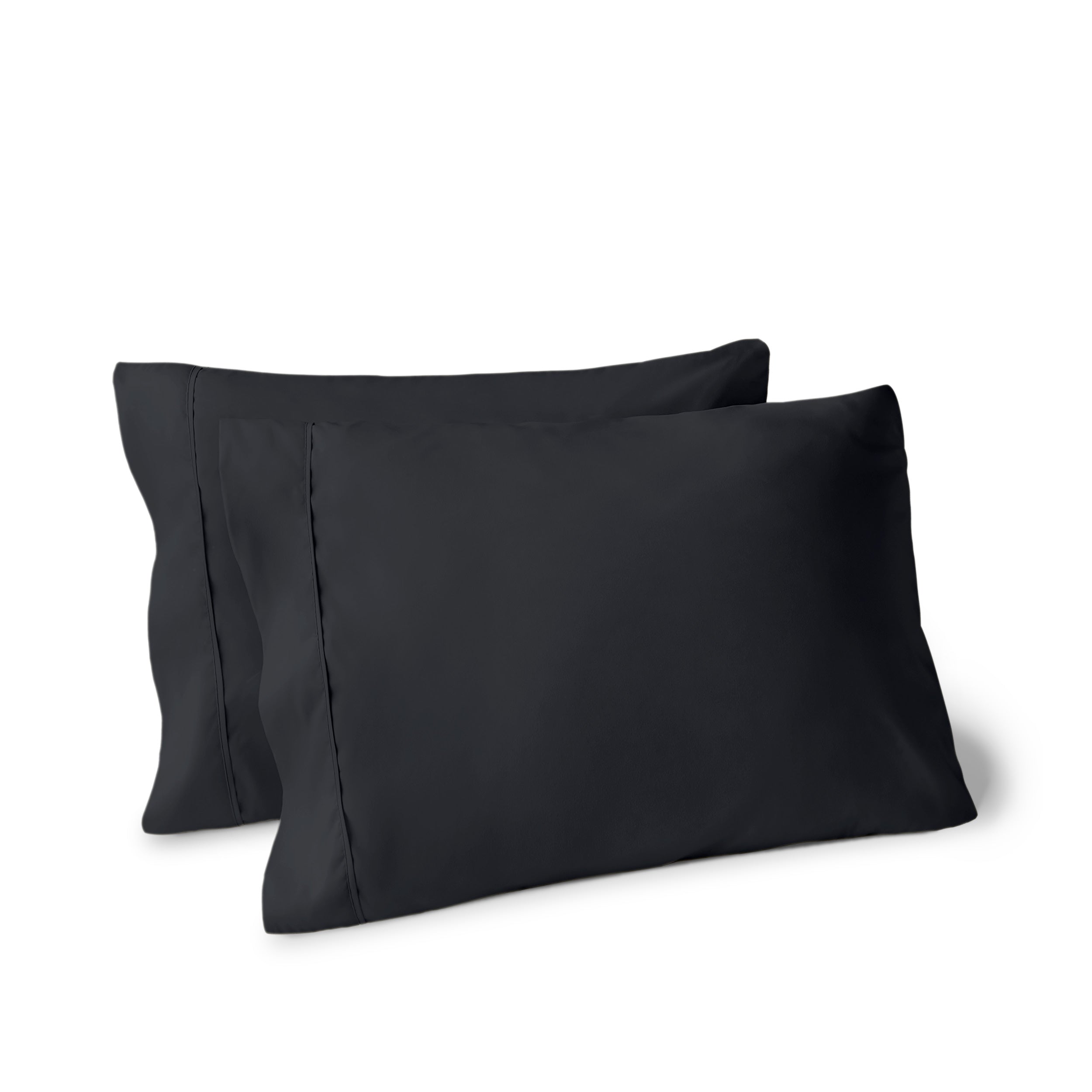 Two pillows on a white background with pillowcases on them