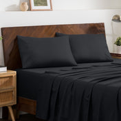 2 pillowcases on pillows on a nicely made bed