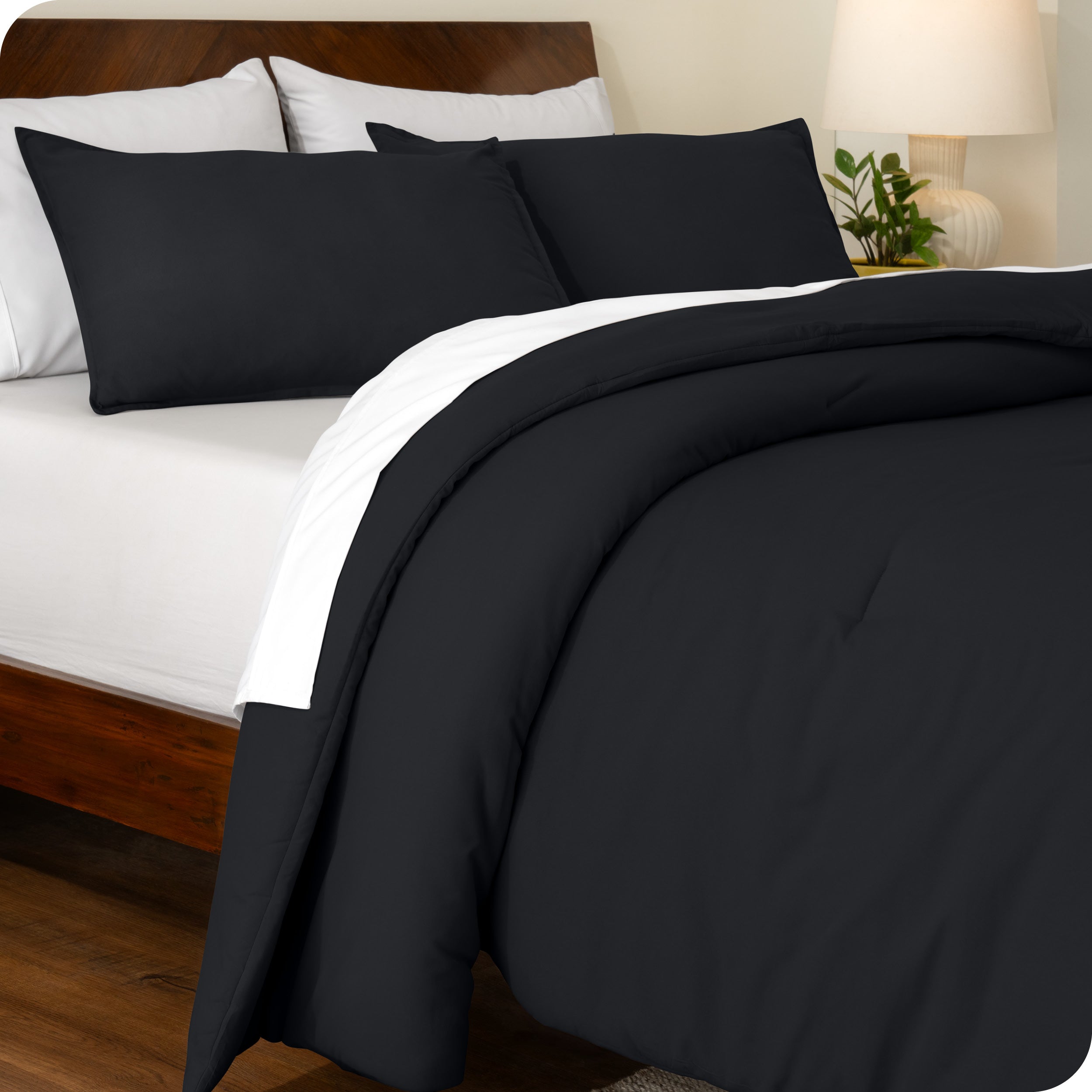 An angled view of a comforter set on a bed