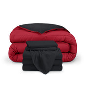 A reversible microfiber comforter and a coordinating sheet set folded and stacked