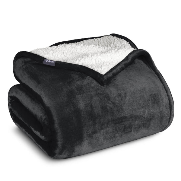 A sherpa blanket folded neatly while showing both sides