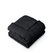 A folded cotton weighted blanket with a white background