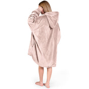An adult with a hooded wearable blanket on