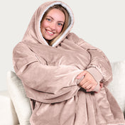 An adult with a sherpa wearable blanket on