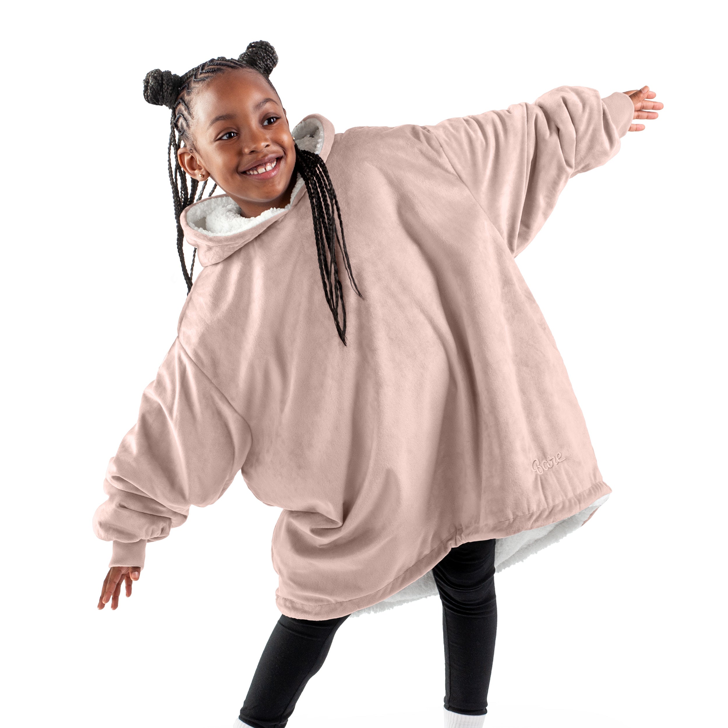 A child with a wearable blanket on