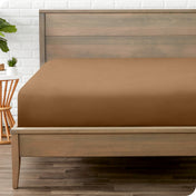 A mattress with just a fitted sheet on it