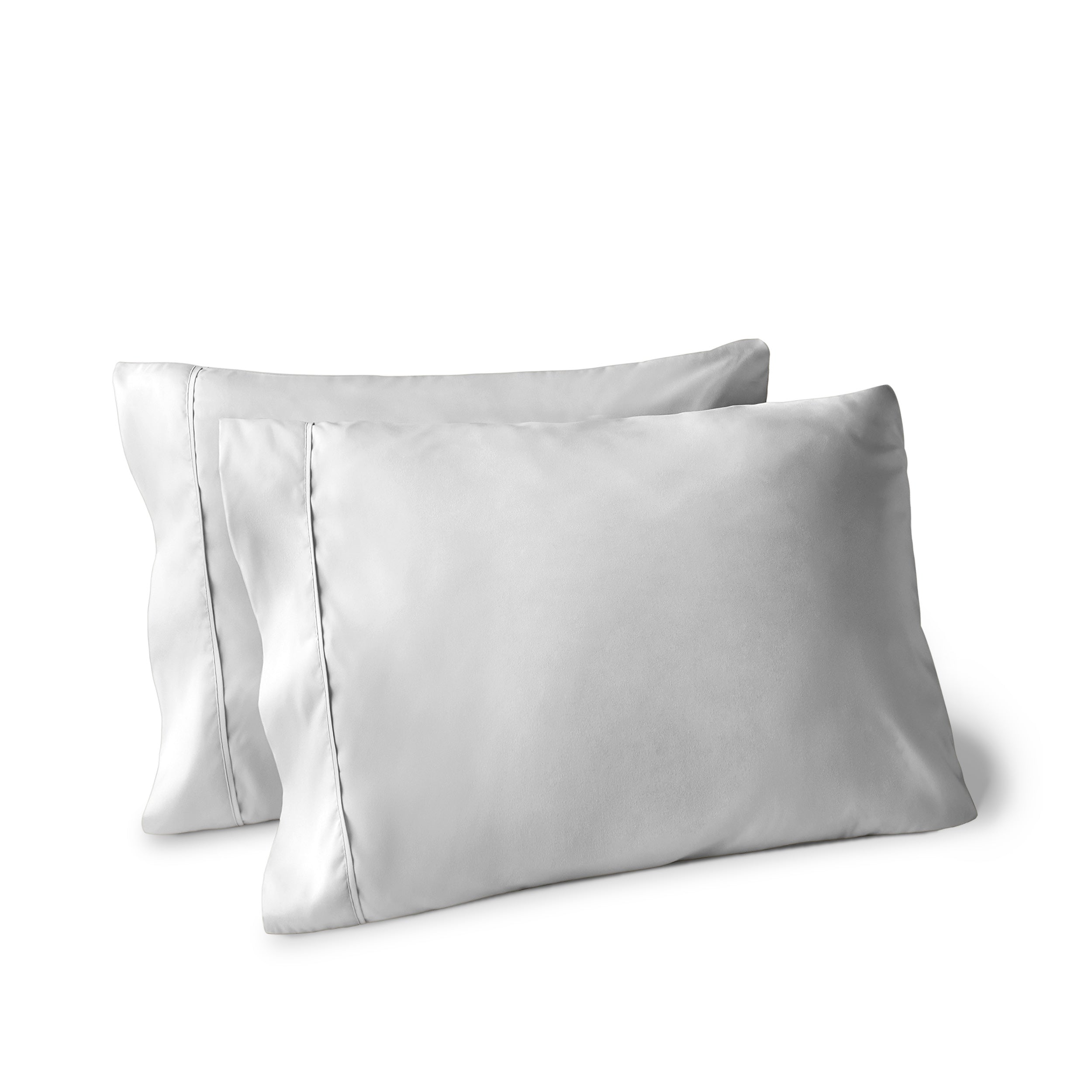 Two pillows on a white background with pillowcases on them