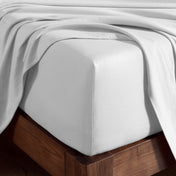 Organic cotton jersey sheet set on a wooden bed frame
