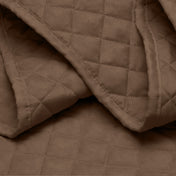 Close in view showing texture of coverlet set fabric