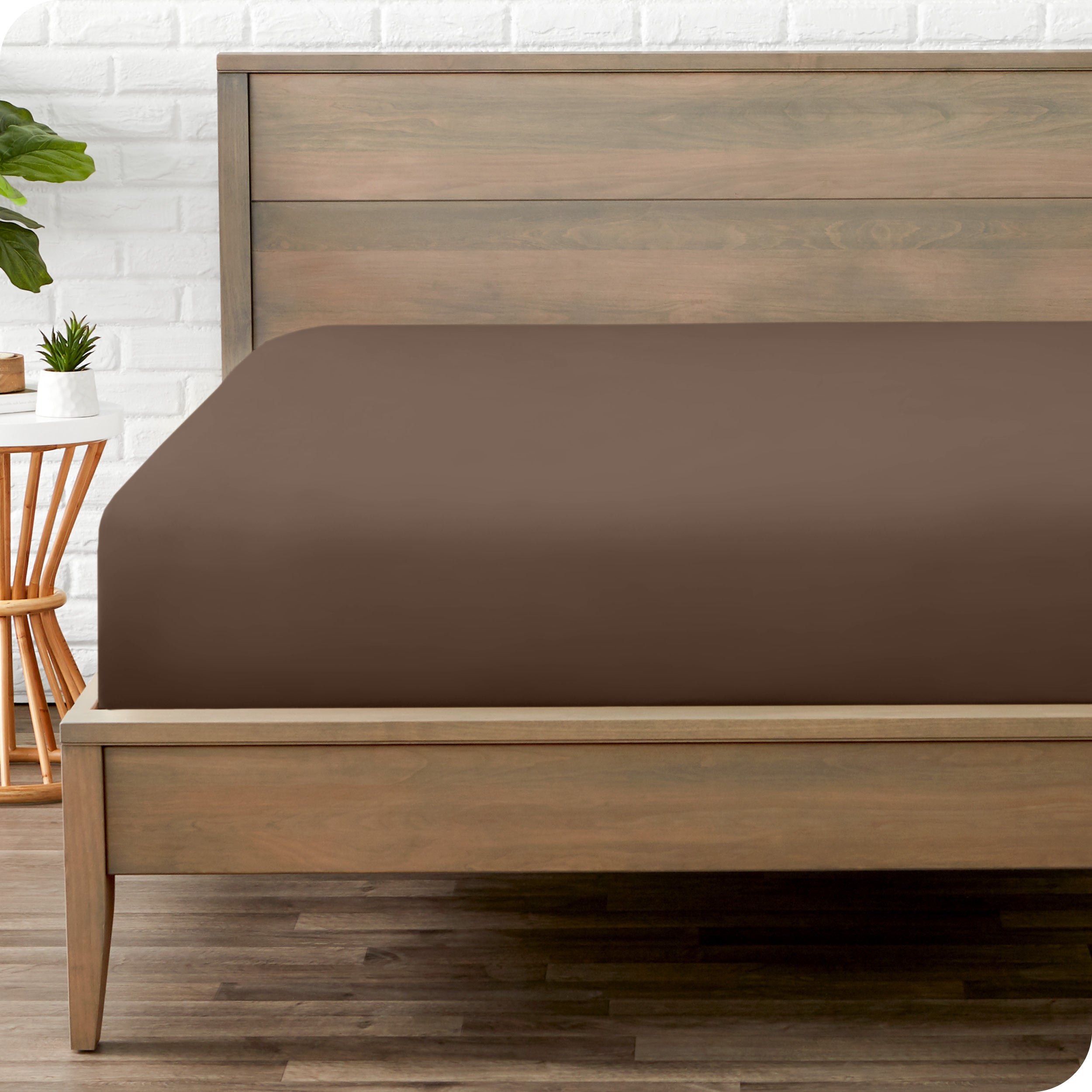 A mattress with just a fitted sheet on it