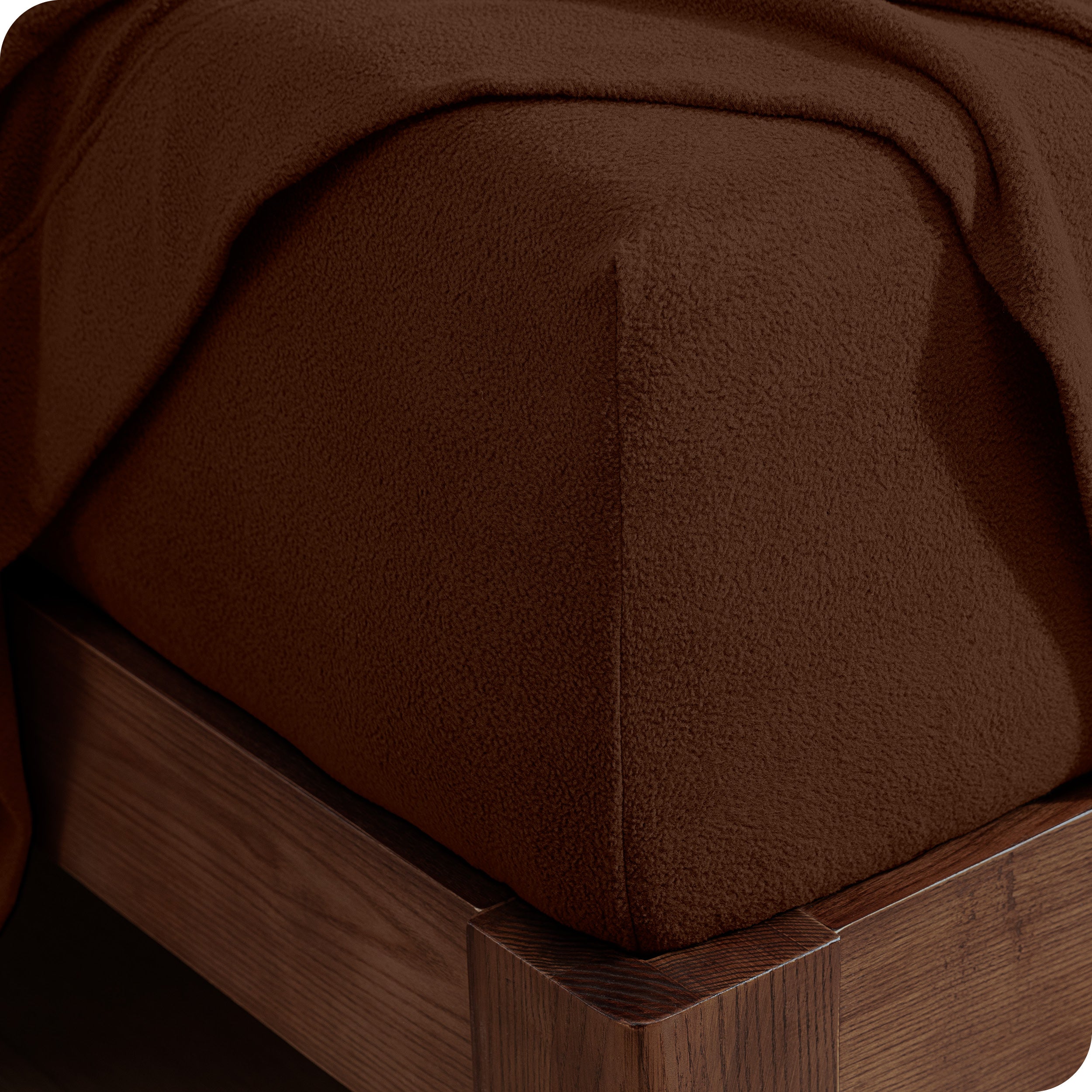 Fitted sheet on a wooden bed frame
