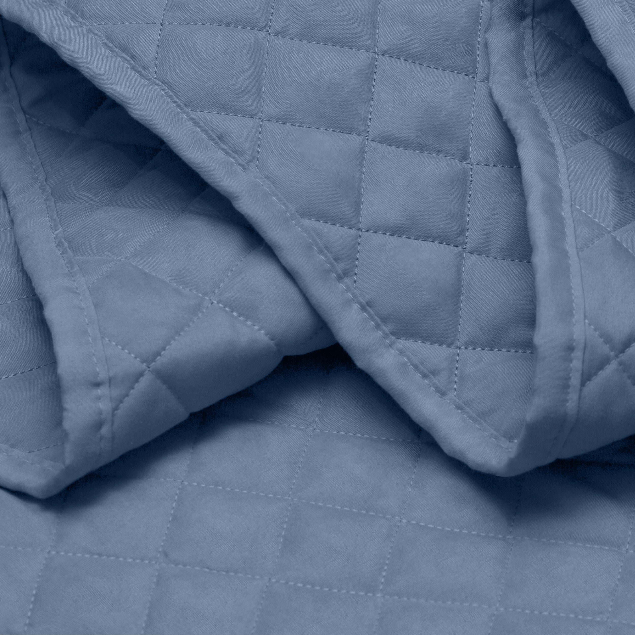 Close in view showing texture of coverlet set fabric