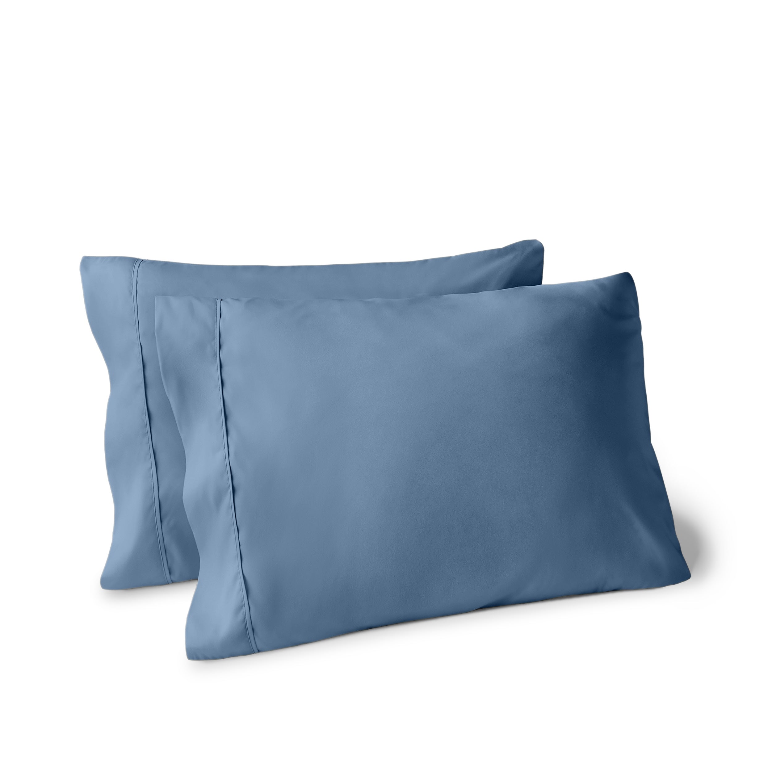 Two pillows on a white background with pillowcases on them