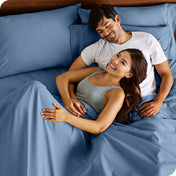 A smiling couple in bed
