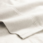 Close-up of flannel fabric with a focus on texture and color.
