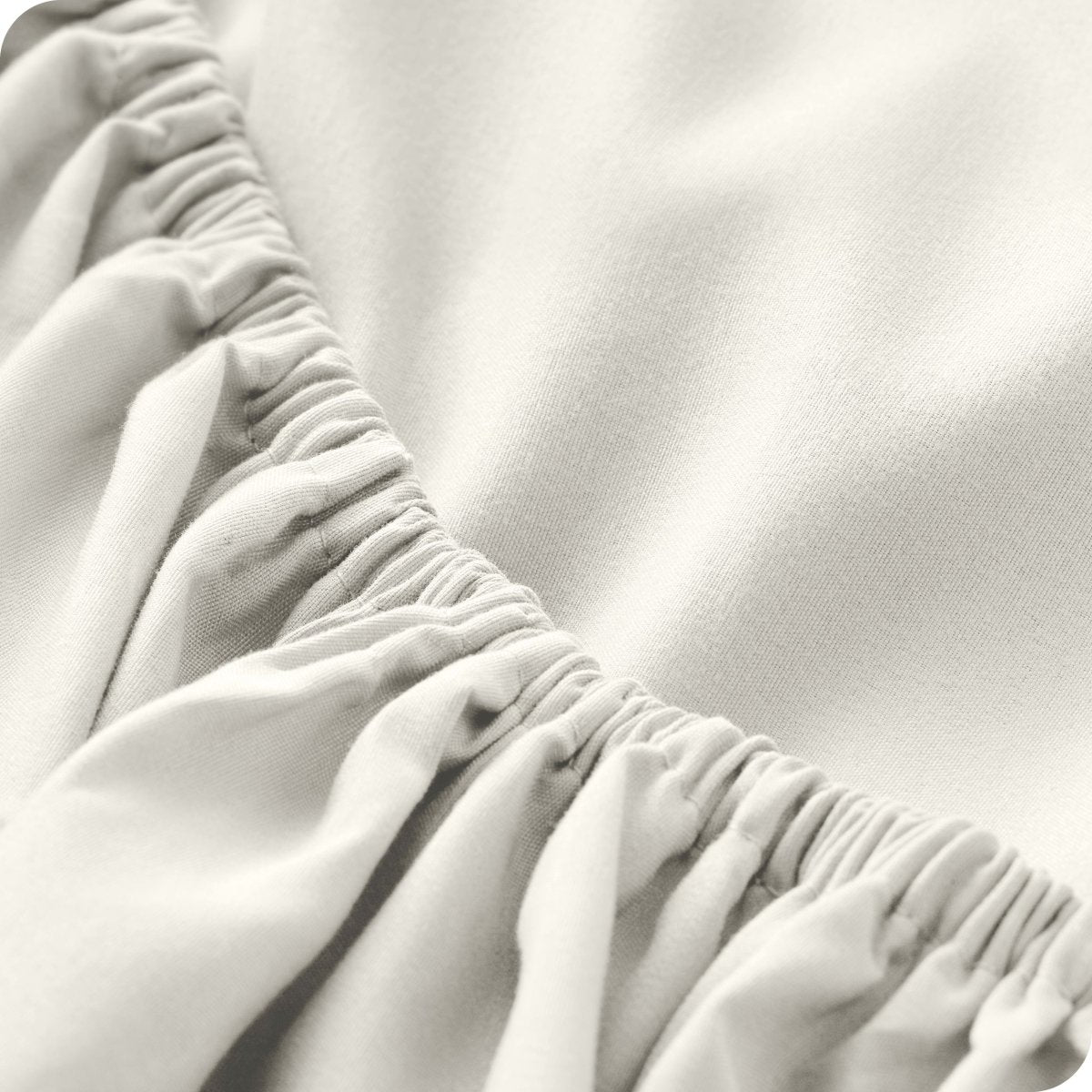 Close up of a microfiber fitted sheet showing the elastic