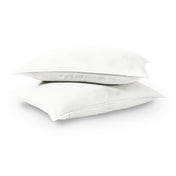 Two pillows stacked on a white background