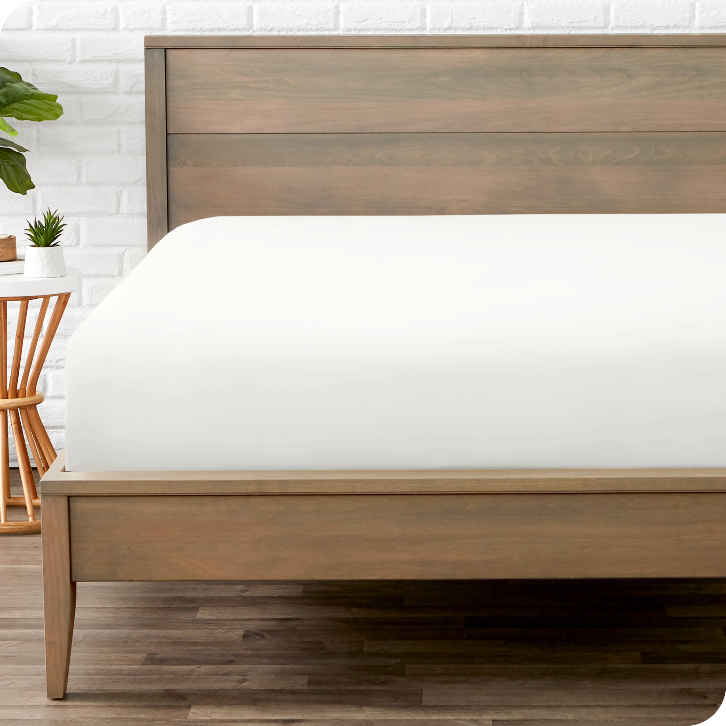A mattress with just a fitted sheet on it