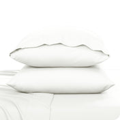 2 pillowcases on pillows