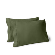 Two pillows on a white background with pillowcases on them
