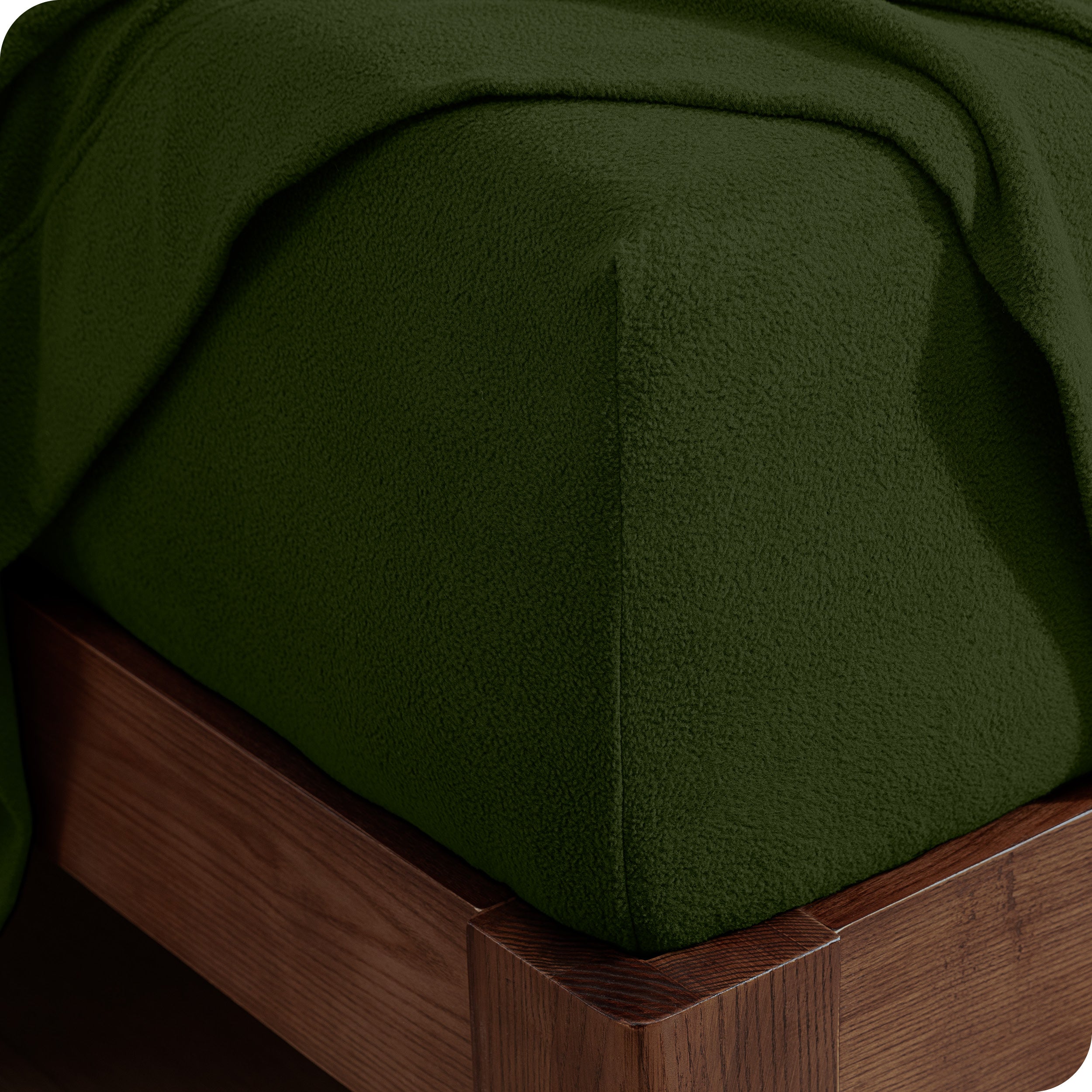 Fitted sheet on a wooden bed frame