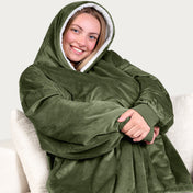 An adult with a sherpa wearable blanket on